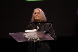 Poet Anne Carson reading at the 2024 National Book Awards finalist event