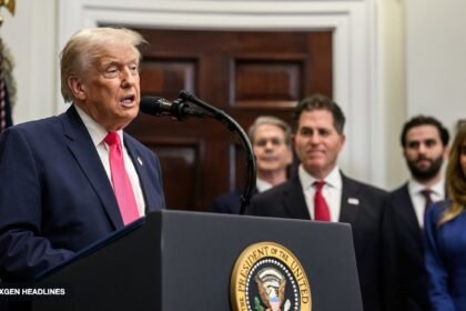 President Trump speaks at a White House podium as Michael Dell and Susan Dell stand behind him during the Trump Accounts announcement