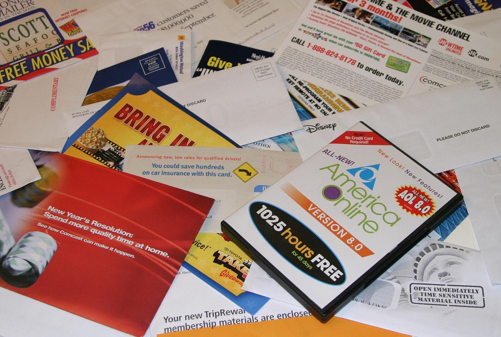 A pile of junk mail, catalogs and credit card offers
