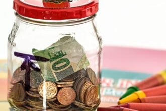 A piggy bank on a table representing small regular savings invested in index funds