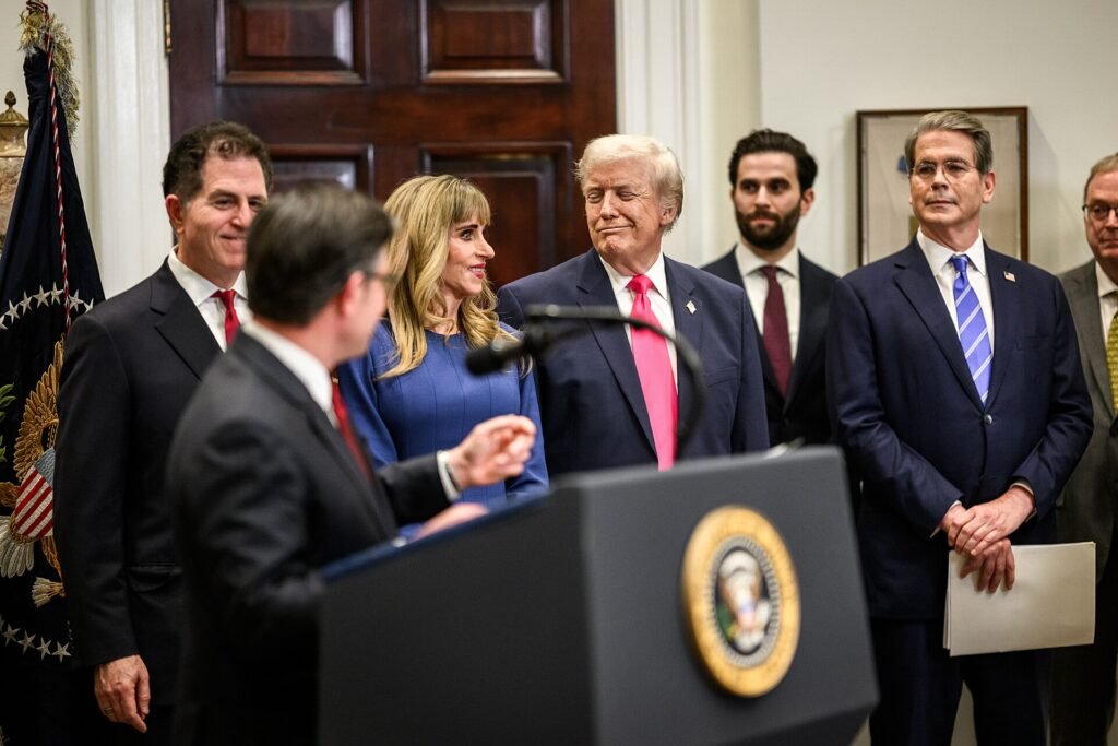 Michael Dell and Susan Dell smile next to President Trump at the White House Trump Accounts announcement