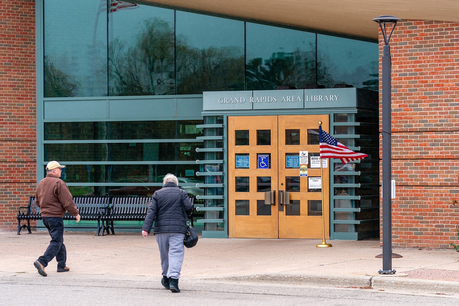 Voters walking into a polling place on Election Day