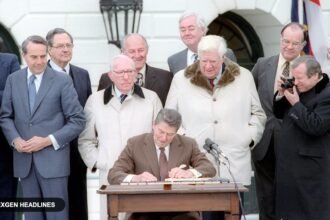 President Ronald Reagan signs the Social Security Amendments of 1983 on the White House South Lawn