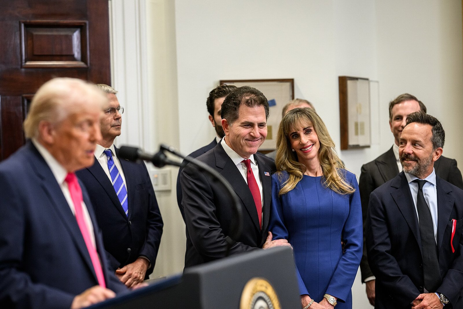 Michael Dell and Susan Dell smile as President Trump announces their Trump Accounts donation at the White House